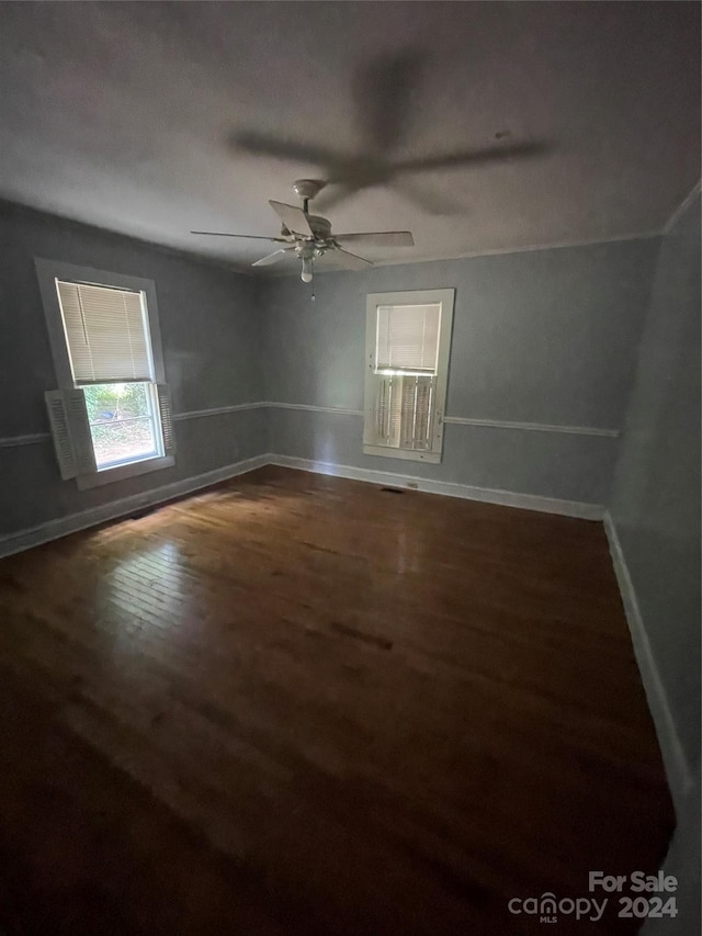 unfurnished room featuring ceiling fan and wood-type flooring