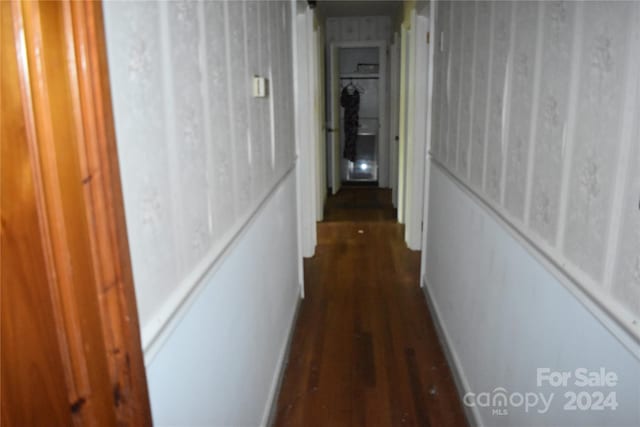 corridor with dark wood-type flooring