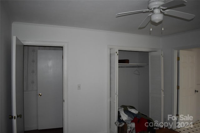 bedroom featuring ornamental molding and ceiling fan