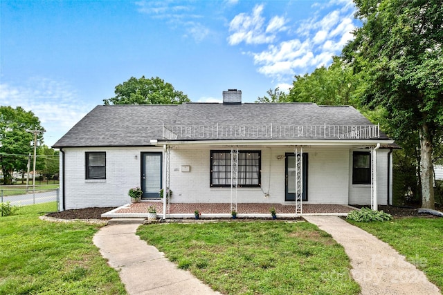 single story home with a front lawn and a porch