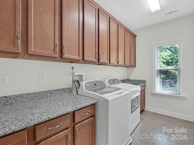 laundry area featuring independent washer and dryer, cabinets, hookup for a washing machine, sink, and light tile floors