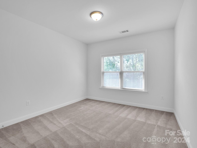 unfurnished room with carpet floors