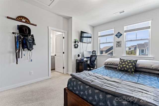 carpeted bedroom with ensuite bathroom