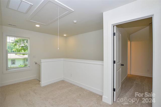 empty room with light colored carpet