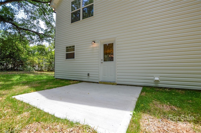 exterior space featuring a patio and a yard