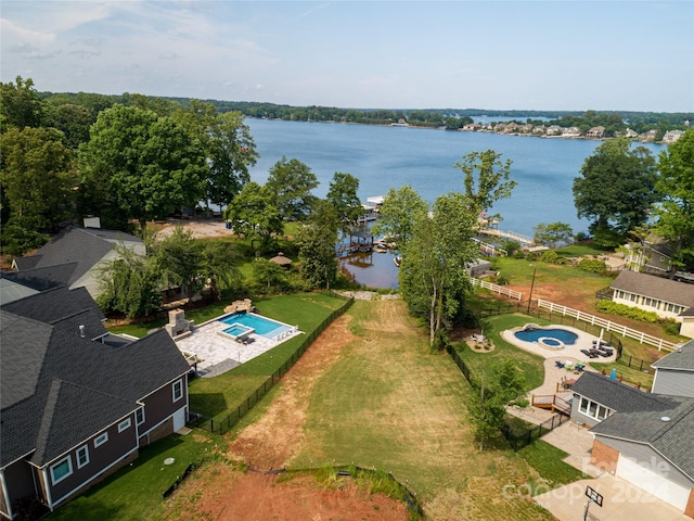 birds eye view of property with a water view