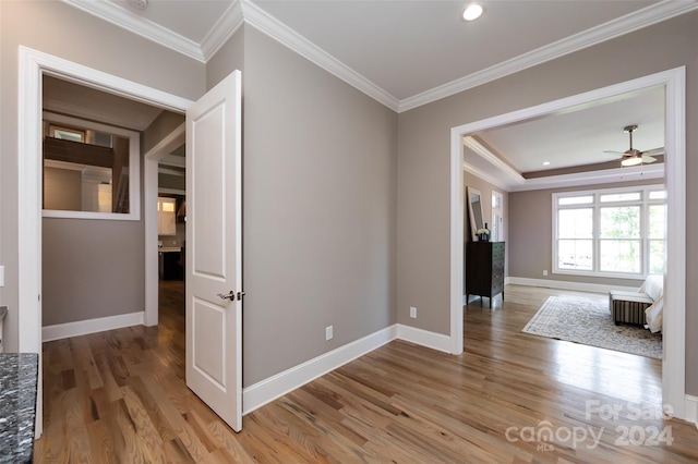 unfurnished room featuring ceiling fan, crown molding, and hardwood / wood-style floors