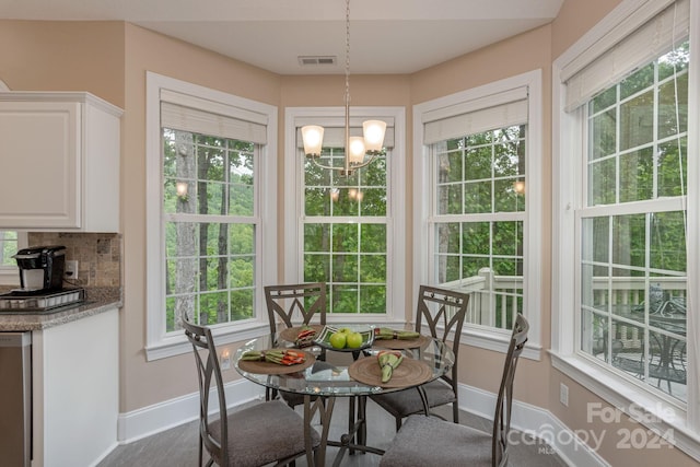 dining space featuring a chandelier