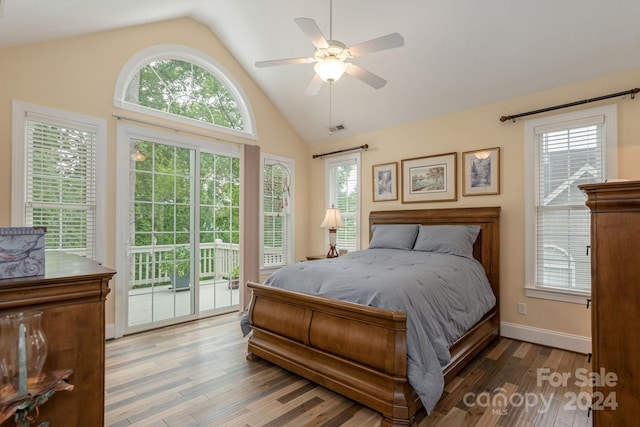 bedroom featuring hardwood / wood-style flooring, multiple windows, ceiling fan, and access to exterior