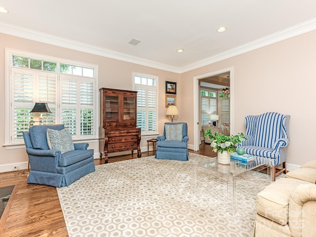 interior space with crown molding and hardwood / wood-style flooring