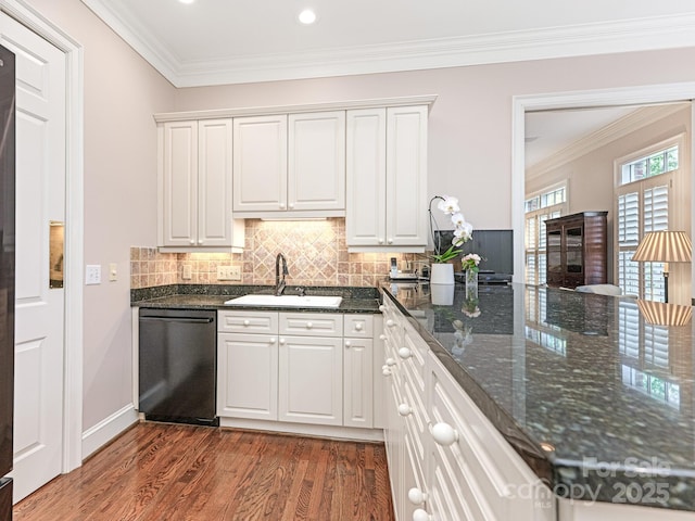 kitchen with dishwasher, white cabinets, and sink