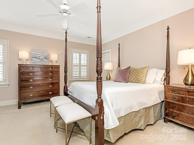 carpeted bedroom with ceiling fan and crown molding