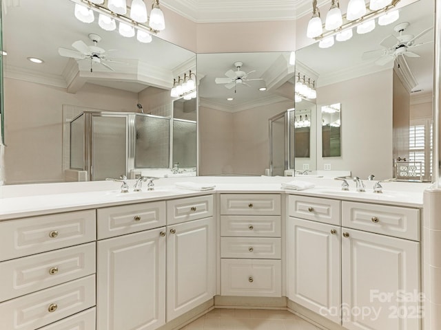 bathroom featuring walk in shower, vanity, ceiling fan, tile patterned floors, and ornamental molding