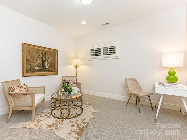 living area with carpet