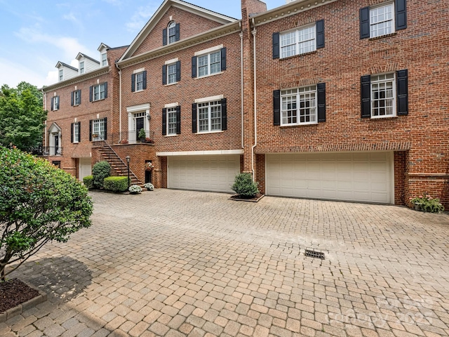 multi unit property featuring a garage