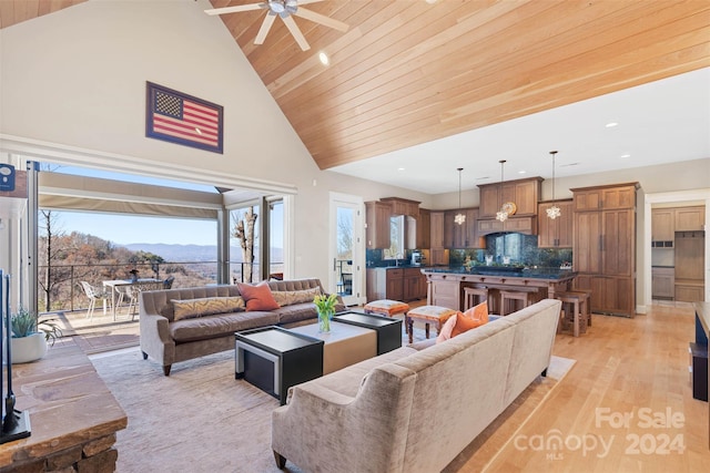 living room featuring high vaulted ceiling, wood ceiling, ceiling fan, and light hardwood / wood-style flooring