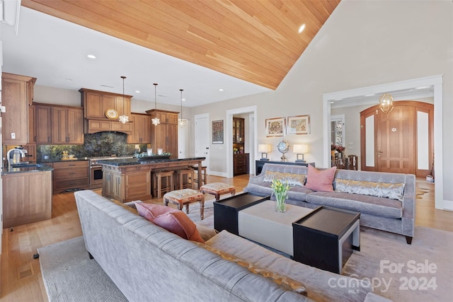 living room with high vaulted ceiling, sink, wooden ceiling, and light hardwood / wood-style flooring