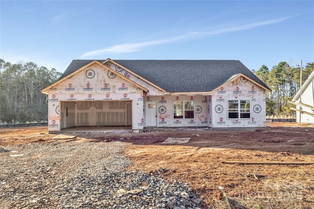 unfinished property featuring a garage