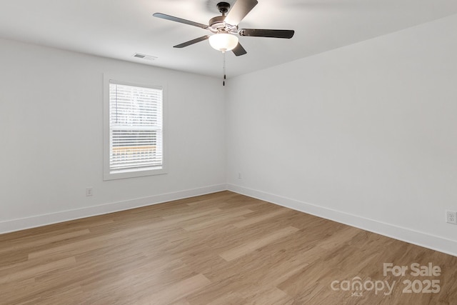 unfurnished room with ceiling fan and light hardwood / wood-style flooring