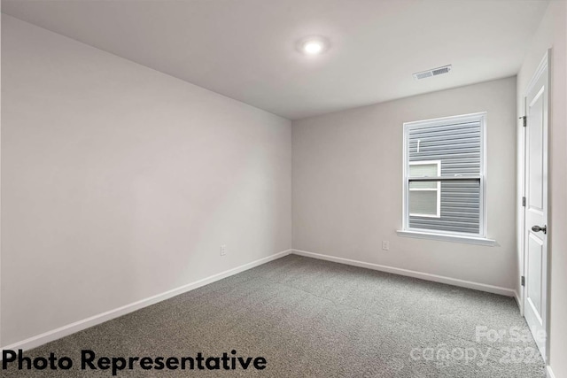 unfurnished room with carpet flooring