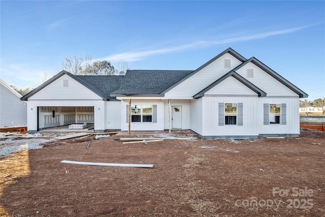 modern farmhouse style home with a garage