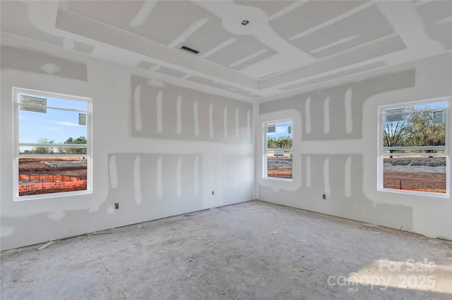 unfurnished room featuring a wealth of natural light