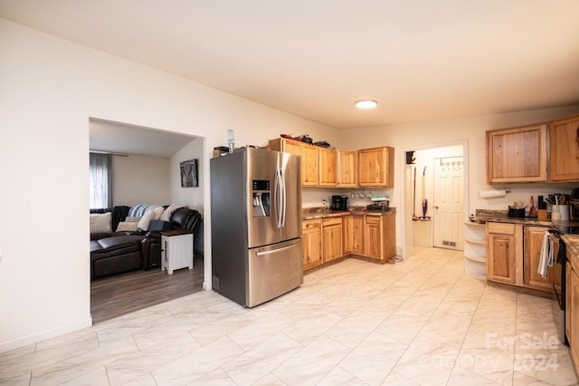 kitchen featuring stainless steel fridge