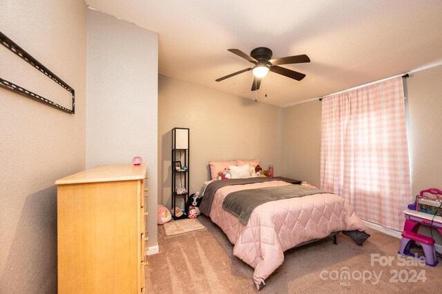 bedroom featuring ceiling fan and light colored carpet