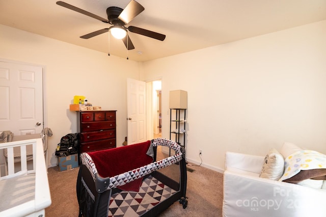 bedroom with ceiling fan and light colored carpet