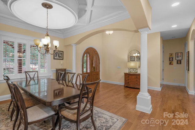 dining space featuring an inviting chandelier, hardwood / wood-style floors, coffered ceiling, and decorative columns