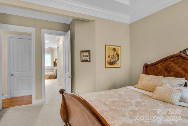 carpeted bedroom with ornamental molding