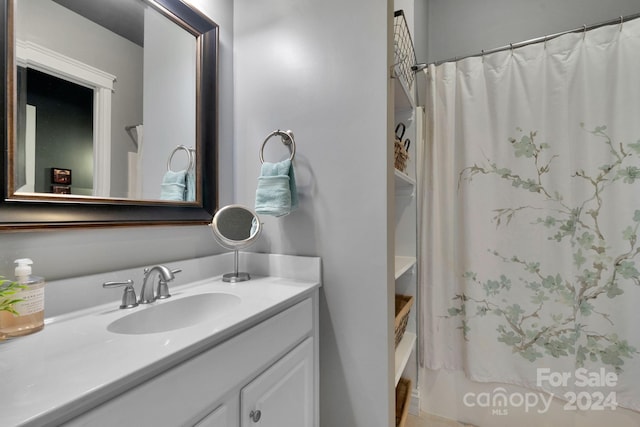 bathroom featuring vanity with extensive cabinet space