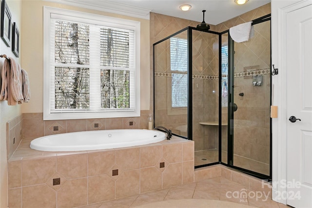 bathroom with tile flooring, crown molding, and plus walk in shower