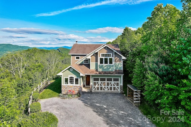 view of front of house featuring a mountain view and a garage