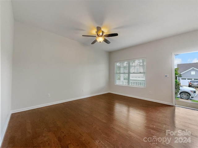 spare room featuring ceiling fan and hardwood / wood-style flooring