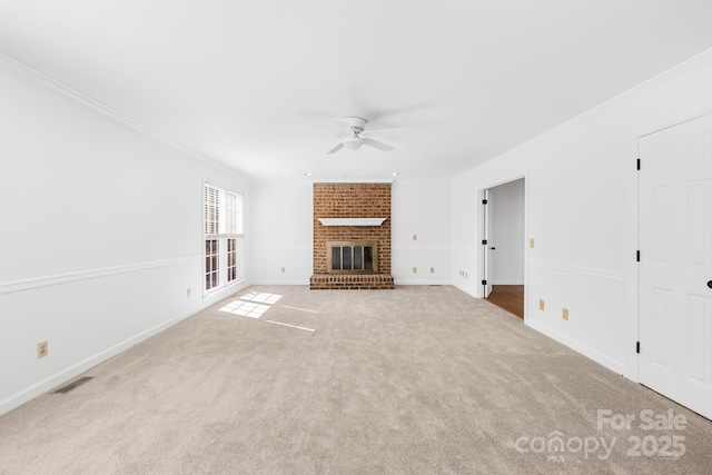 unfurnished living room featuring ceiling fan, a fireplace, carpet flooring, visible vents, and ornamental molding