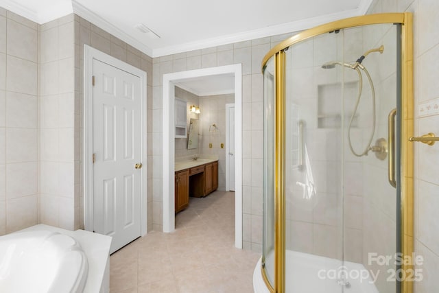 full bath featuring a garden tub, tile walls, a shower stall, tile patterned floors, and crown molding