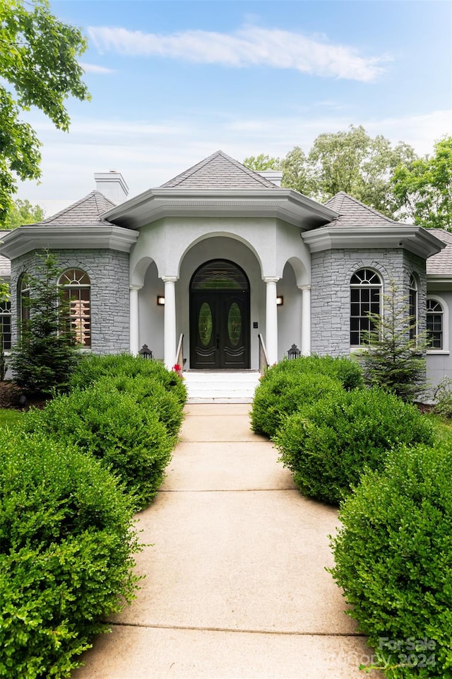 doorway to property featuring a porch