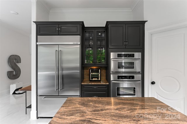 kitchen featuring crown molding and stainless steel appliances