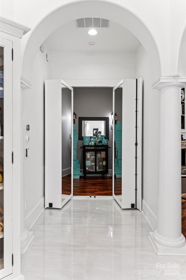 corridor with light tile patterned flooring