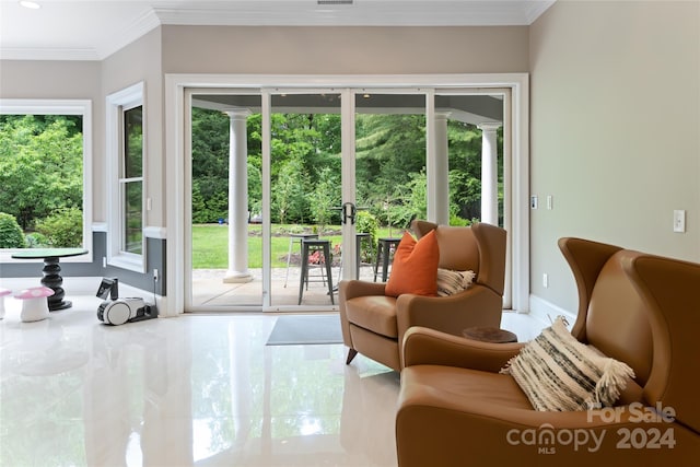 doorway featuring plenty of natural light, tile patterned flooring, and ornamental molding