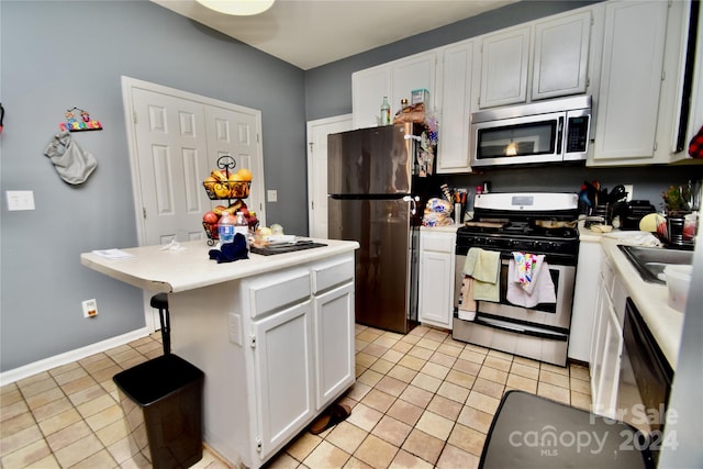 kitchen with light tile flooring, a kitchen island, white cabinetry, appliances with stainless steel finishes, and sink