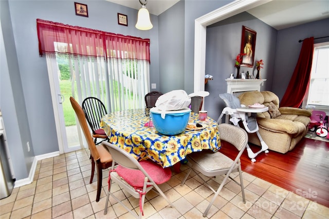 dining room with wood-type flooring