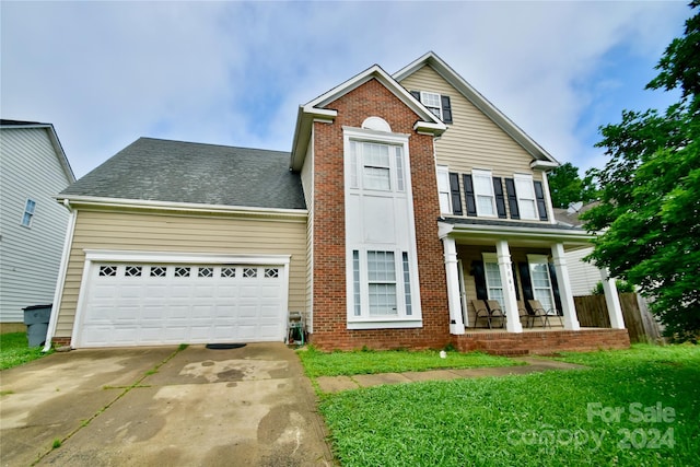 front of property with a garage and a porch