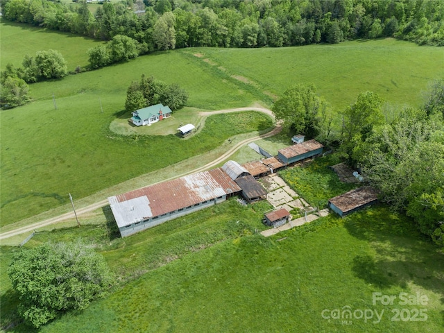 birds eye view of property featuring a rural view