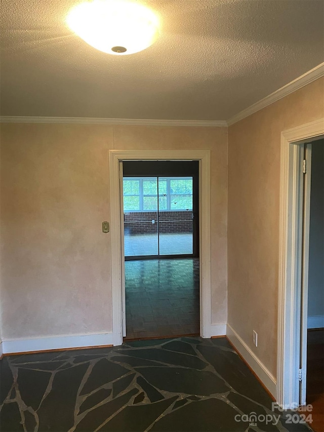 interior space with crown molding and a textured ceiling