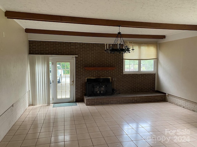 unfurnished living room with beamed ceiling, a textured ceiling, and light tile floors