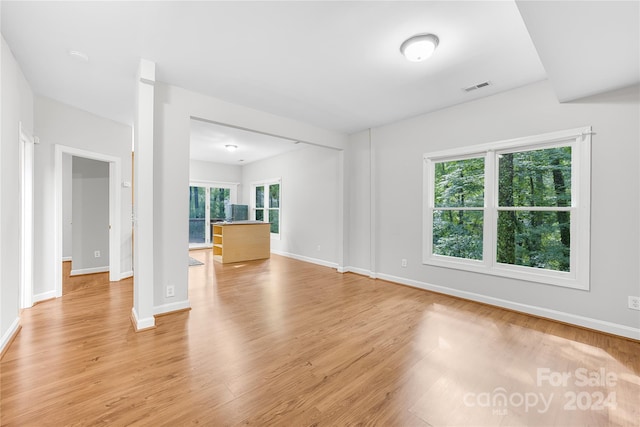 unfurnished living room featuring light hardwood / wood-style flooring