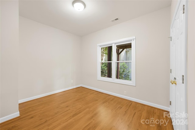 empty room with wood-type flooring