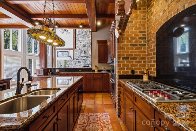 kitchen featuring stainless steel appliances, hanging light fixtures, wood ceiling, beamed ceiling, and light tile floors